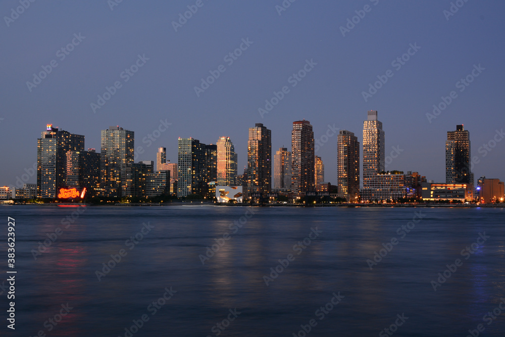 New York, NY, USA - June 27, 2019: Night view to Long Island City and Gantry Plaza State Park from Manhattan