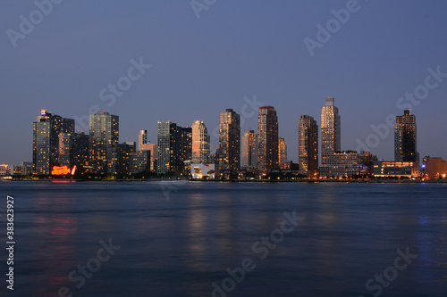 New York, NY, USA - June 27, 2019: Night view to Long Island City and Gantry Plaza State Park from Manhattan © Andrey
