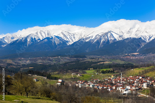 Distant view of Barakli village and snow covered Uludag in the background - Bursa / Turkey photo