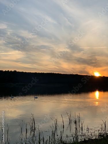 Fototapeta Naklejka Na Ścianę i Meble -  Picturesque sunset on the river with warm colors background