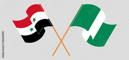 Crossed and waving flags of Nigeria and Syria