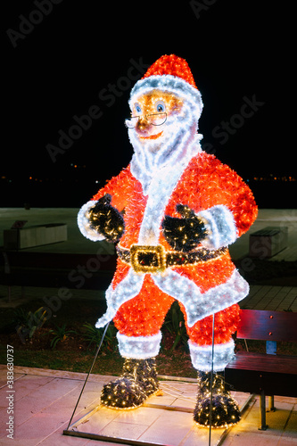 Statue of Santa Claus from garlands. Street Christmas decoration.