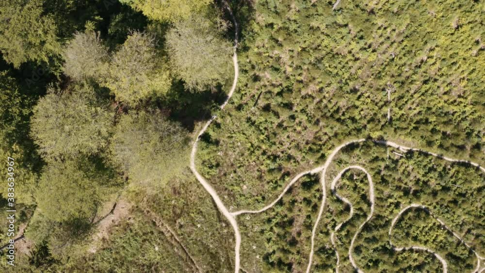 Drone Shot Of Cyclists Riding Through Field Drone Shot Of Cyclists Riding Through Field