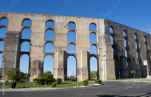 Old aqueduct. Beautiful wallpaper on a background of blue sky