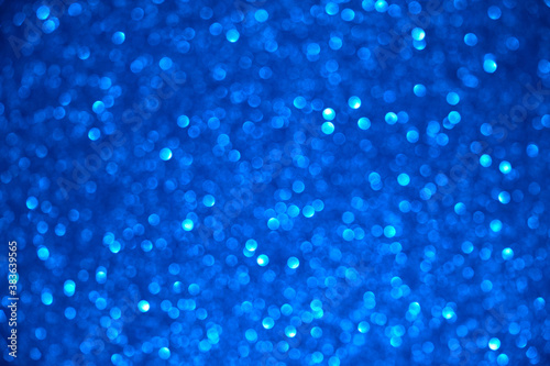 blue glitter texture christmas abstract background with bokeh