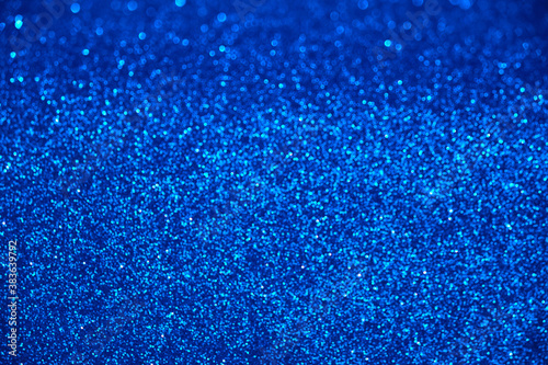 blue glitter texture christmas abstract background with bokeh