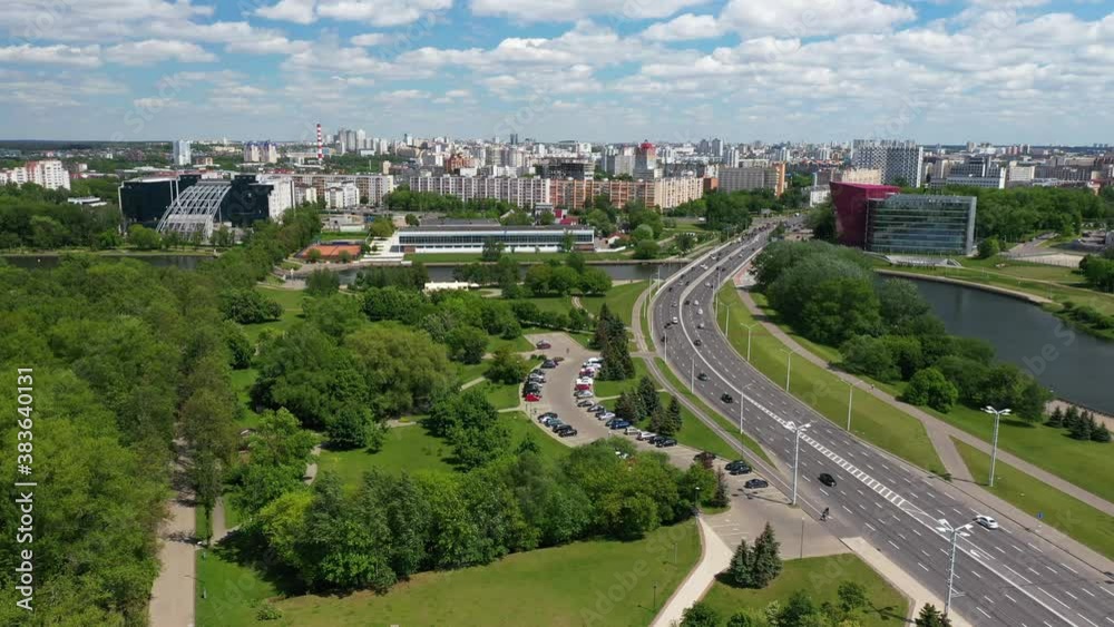 View of Masherov Avenue in Minsk, Belarus. Cars move fast along the highway in the city. Top view from drone. Top view of the city landscape. Buildings and roads in summer.
View of Masherov Avenue in Minsk, Belarus. Cars move fast along the highway in the city. Top view from drone. Top view of the city landscape. Buildings and roads in summer.