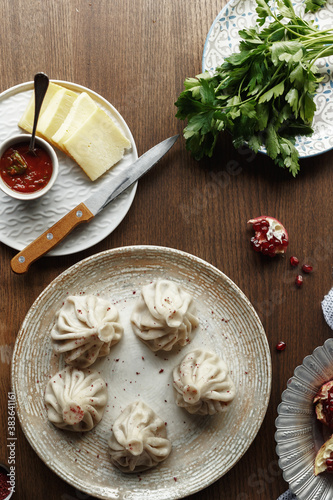 dishes and snacks of traditional Caucasian Georgian cuisine. classic national serving on a rustic wooden table