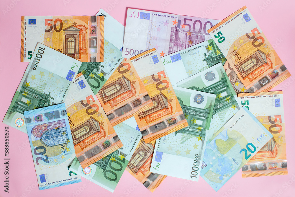 a small pile of paper euro bills as part of the trading system