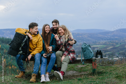 group of happy young travelers enjoying nature