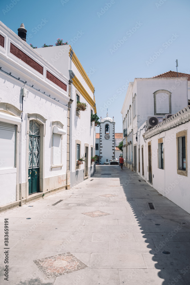 beautiful style of building white houses in portugal. street photo with a view of houses