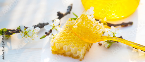 broken yellow fresh honeycomb with honey on table. Honey products. healthy natural food concept. Selective focus