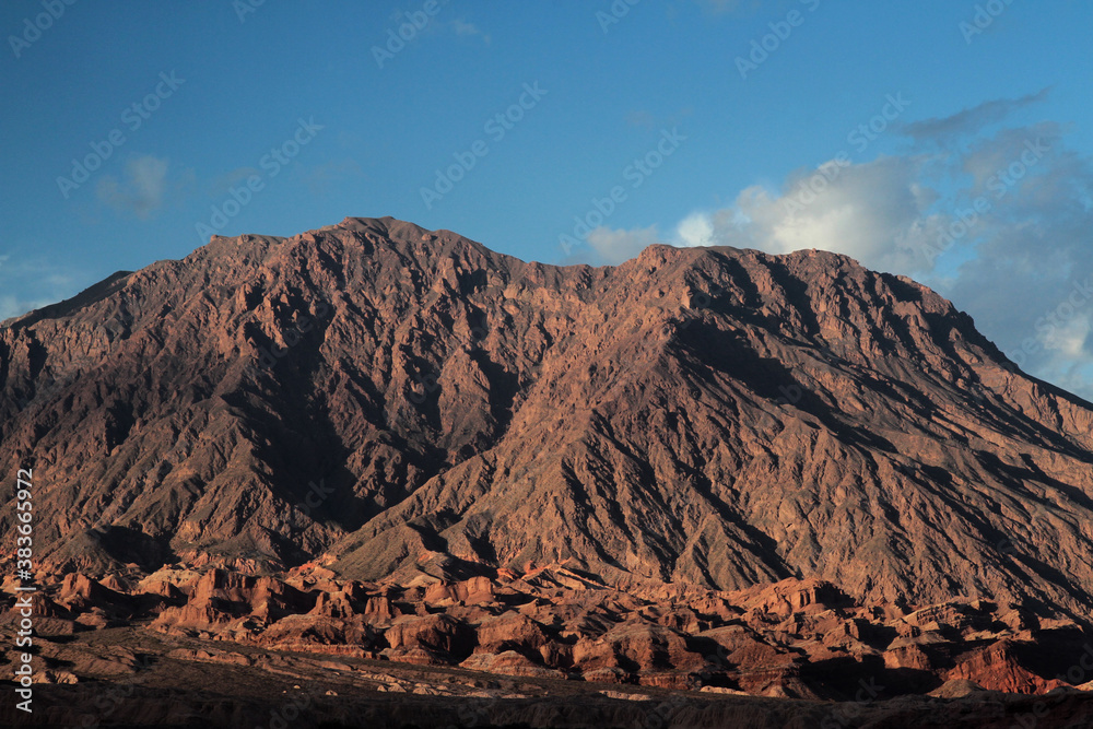 Beauty in nature. Closeup view of the brown mountain, arid desert and sandstone hills at sunset. 
