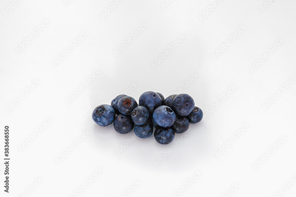 A pile or group of blueberries isolated on white.