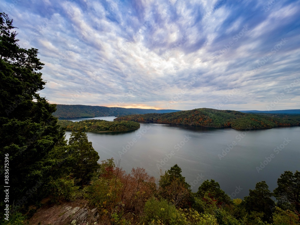 Beautiful view of Raystown Lake in Pennsylvania from Hawn’s Overlook in the fall with the water still and the sky filled with pink, blue, purple and orange right before sunset.  Gorgeous nature.