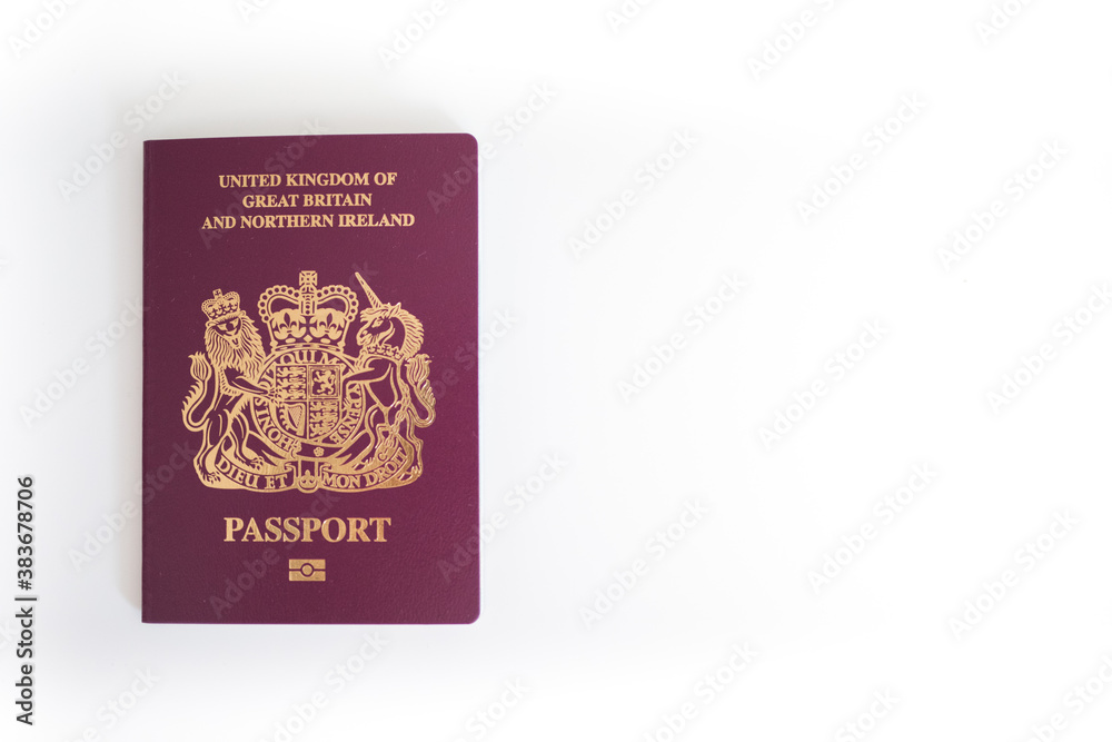 New UK British United Kingdom Passport flatlay against white blank background with copy space New UK British United Kingdom Passport flatlay against white blank background with copy space