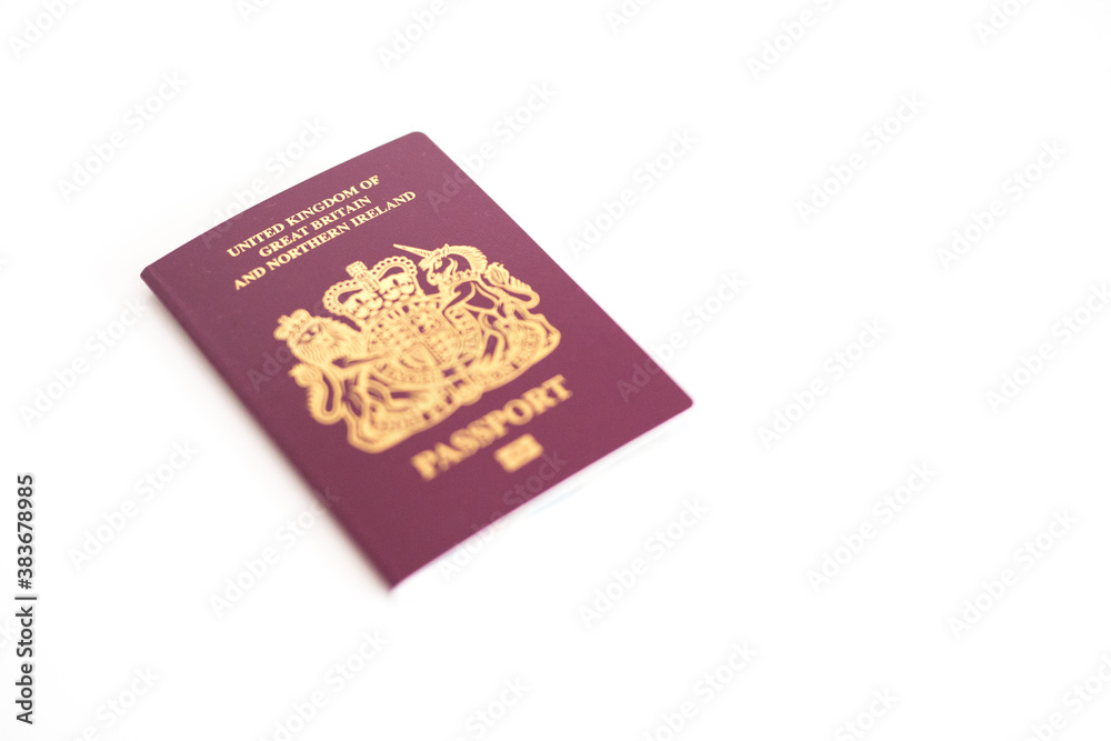 New UK British United Kingdom Passport flatlay against white blank background with copy space New UK British United Kingdom Passport flatlay against white blank background with copy space