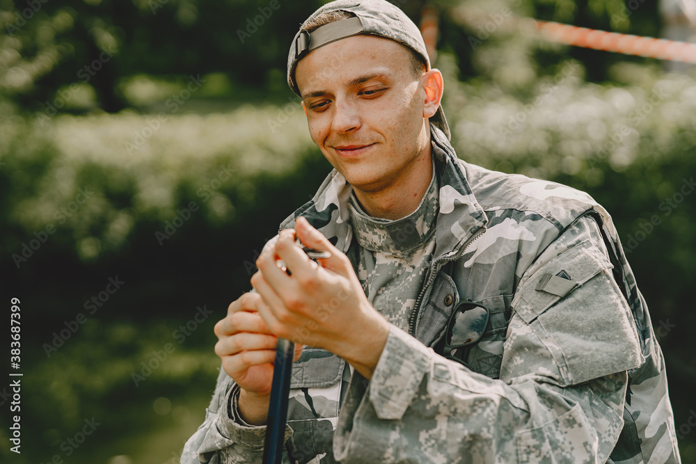 A man fishing on a lake. Guy in a uniform. A man fishing on a lake. Guy in a uniform.