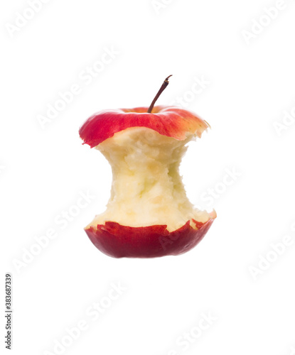Half eaten apple towards white background photo