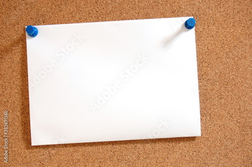 blank sheet of paper on bulletin board photo
