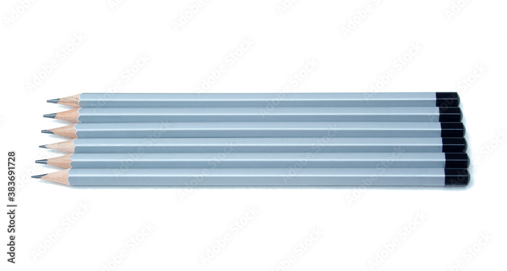 Grey row of graphite pencils isolated on white background. Ready to use for design image. Grey row of graphite pencils isolated on white background. Ready to use for design image.