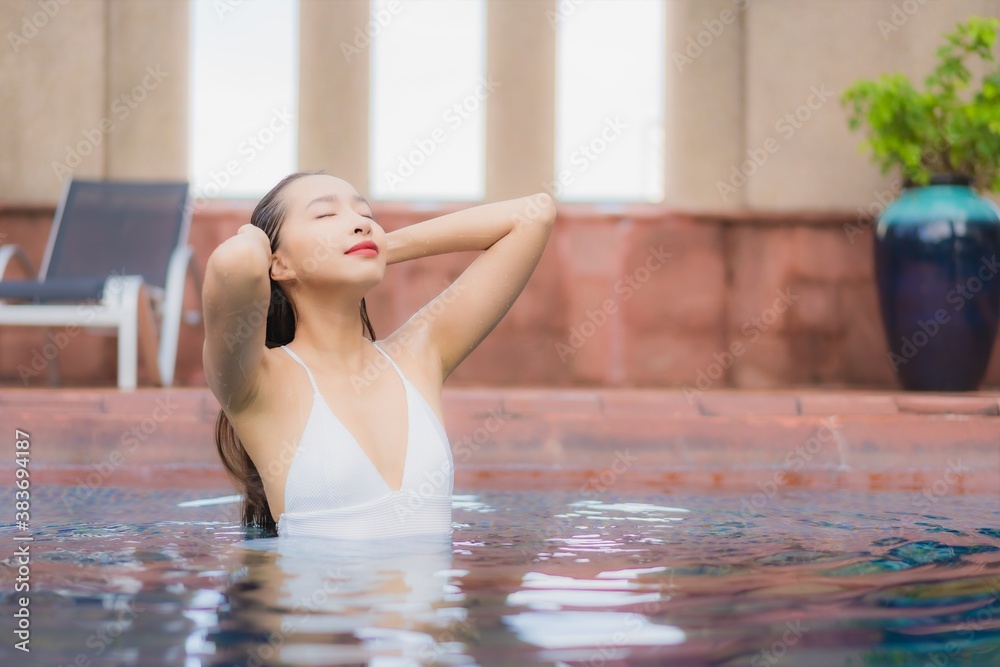 Portrait beautiful young asian woman relax smile leisure around outdoor swimming pool Portrait beautiful young asian woman relax smile leisure around outdoor swimming pool