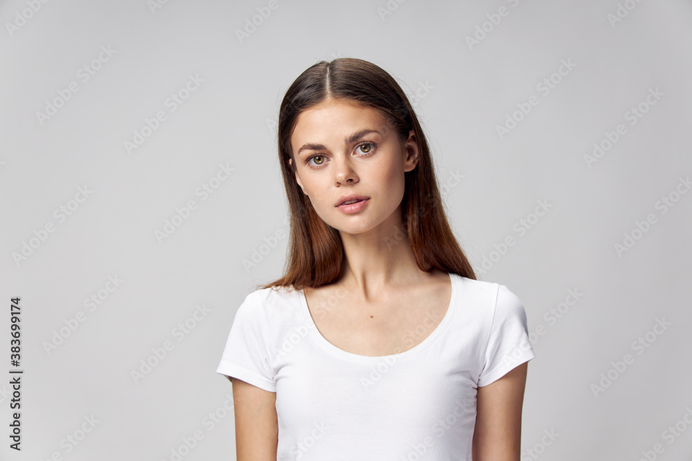 Woman in white t-shirt cropped view look ahead lifestyle Woman in white t-shirt cropped view look ahead lifestyle