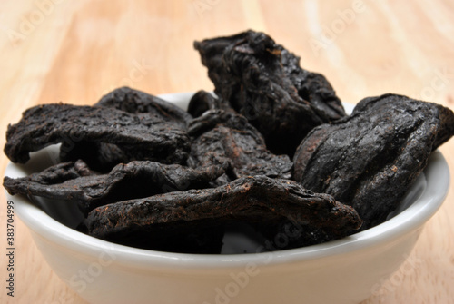 organic black tamarind on a timber board photo