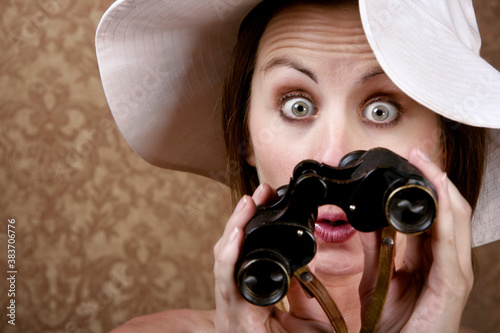 Woman with Sunglasses and Binoculars photo