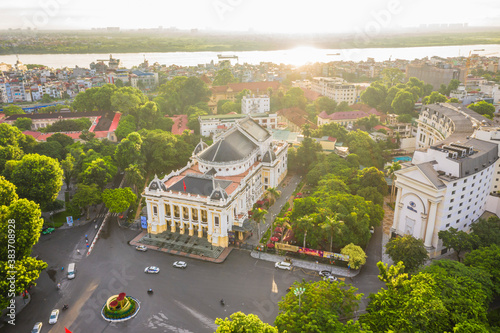 Aerial skyline view of Hanoi city, Vietnam. Hanoi cityscape by sunset period at August Revolution Square, with Hanoi Opera House photo