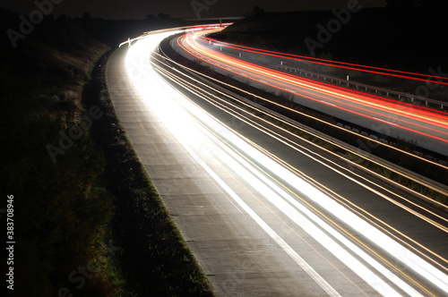 highway at night with traffic photo