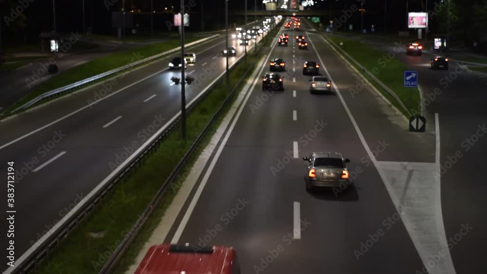 Accelerated static shot of highway scene with night traffic seen from overpass Accelerated static shot of highway scene with night traffic seen from overpass