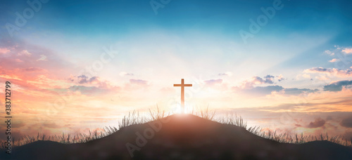 Christian concept  Silhouette cross on  mountain sunset background