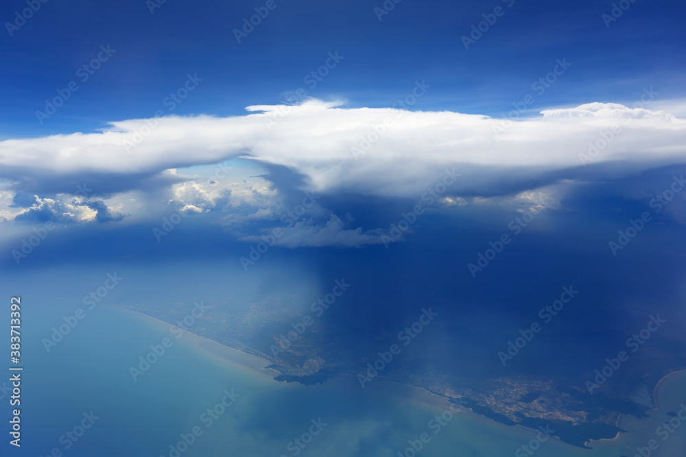 Cloudy blue sky view from airplane window