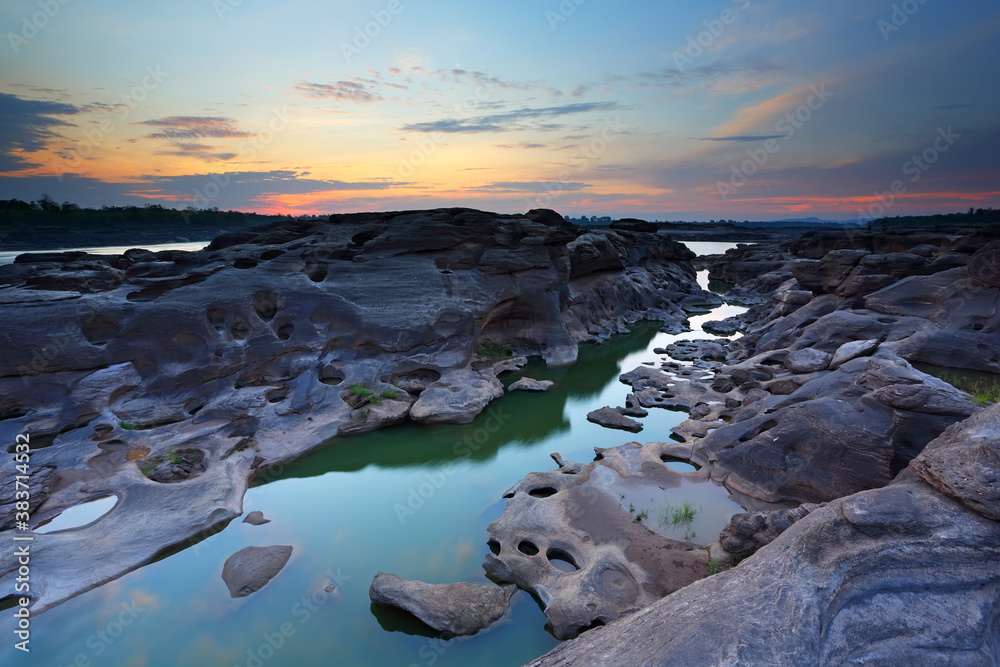 Sunrise of sampanbok (3000 Hole), The Amazing of Rock in Mekong River, Ubon Ratchathani, Thailand