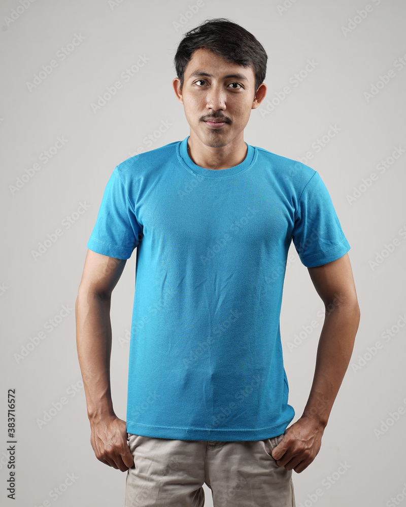 Young men in empty blue T-shirts, stylish and posing like famous T-shirt models. Men's t-shirt template and mockup design for print. photo shoot models isolated white background. Young men in empty blue T-shirts, stylish and posing like famous T-shirt models. Men's t-shirt template and mockup design for print. photo shoot models isolated white background.