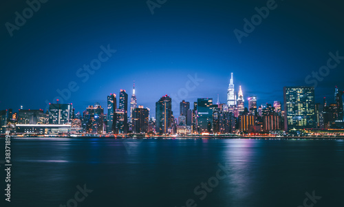 city skyline at night views New York usa sky colors blue reflections 