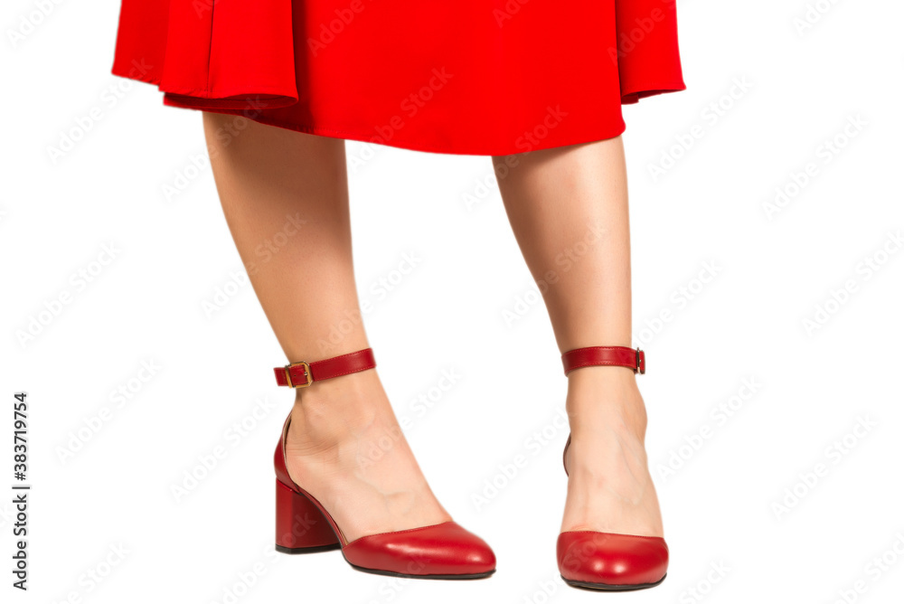 Woman in red dress and in retro red sandals on heels.