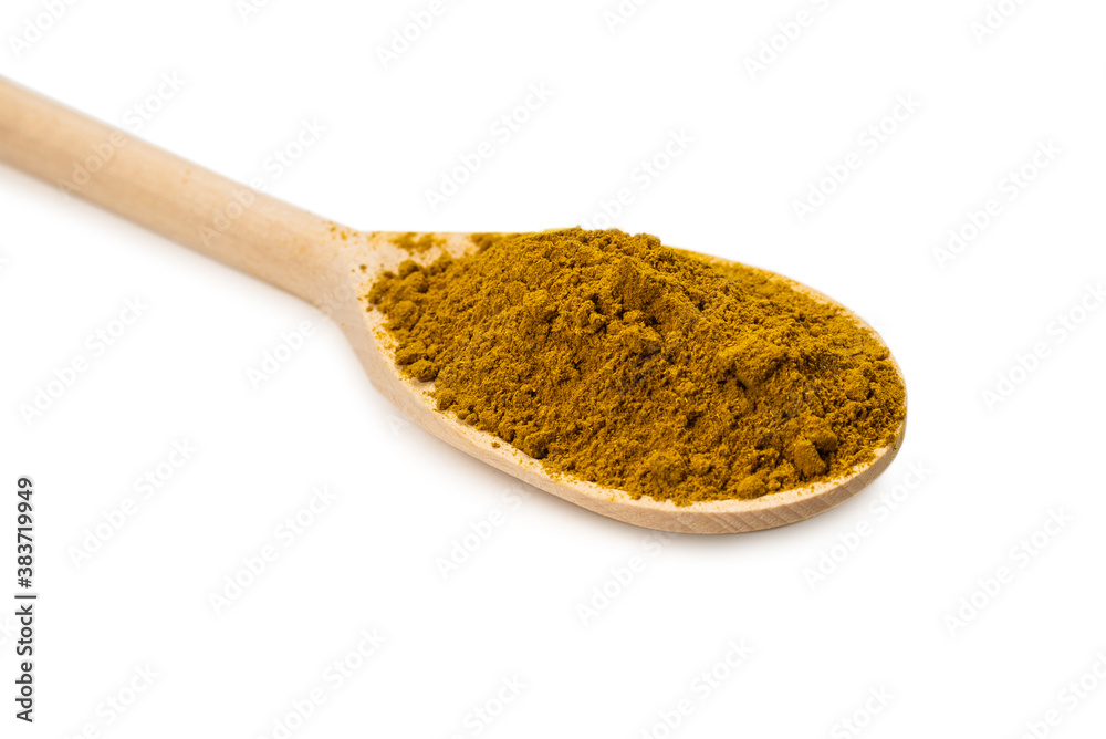 Curry in wooden spoon isolated on white. Curry in wooden spoon isolated on white.