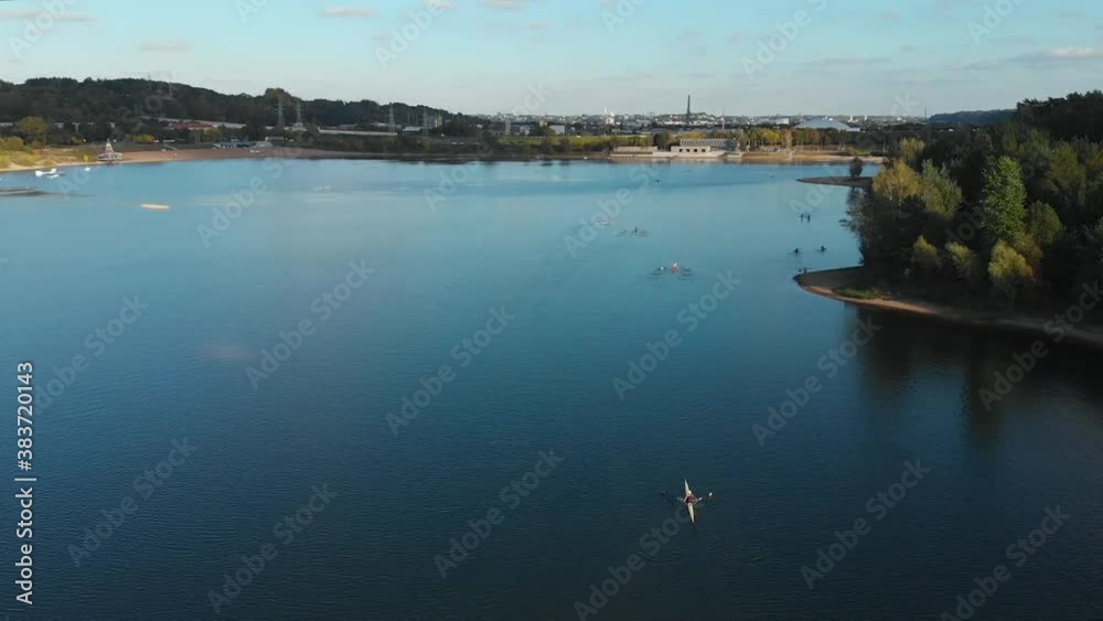 Many kayak going back to shore, aerial backwards uncovering. Many kayak going back to shore, aerial backwards uncovering.