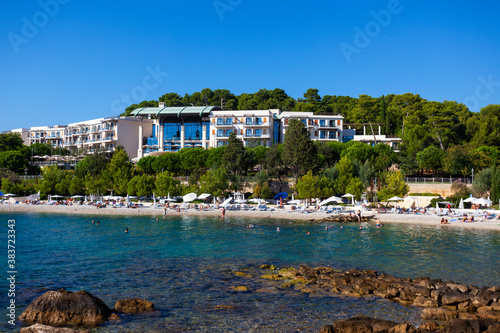 Fototapeta Naklejka Na Ścianę i Meble -  People on the beach in Rovinj town, Croatia