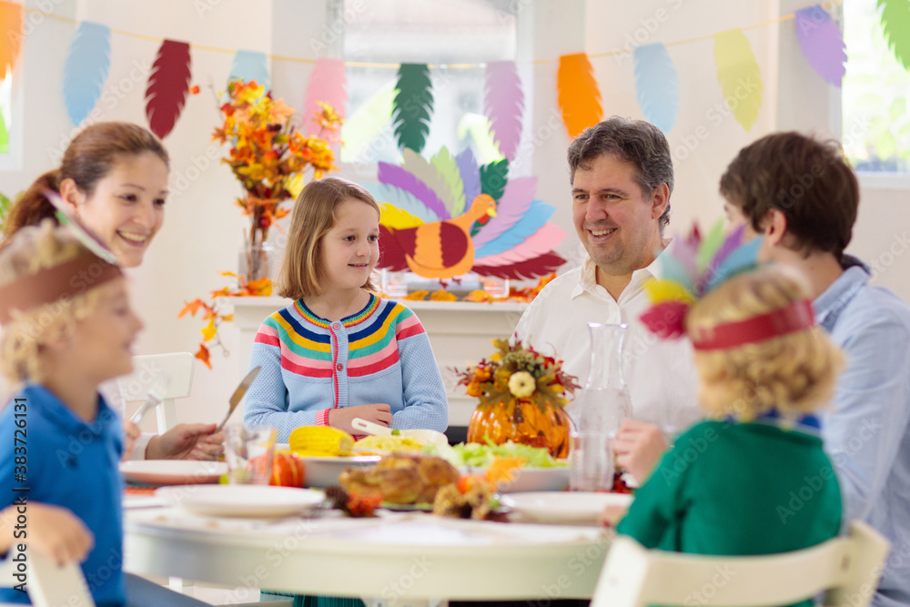 Family with kids at Thanksgiving dinner. Turkey. Family with kids at Thanksgiving dinner. Turkey.