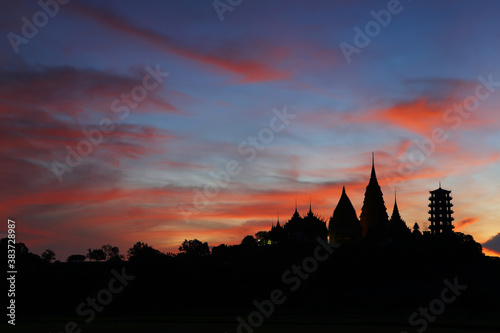 Silhouette of Wat Tham Sua  Tiger Cave Temple  is one of famous temples in the beautiful sunrise in Kanchanaburi province in Thailand