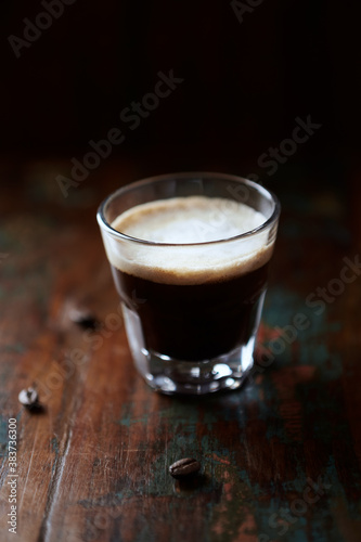 Coffee with milk on dark wooden background. Close up.	