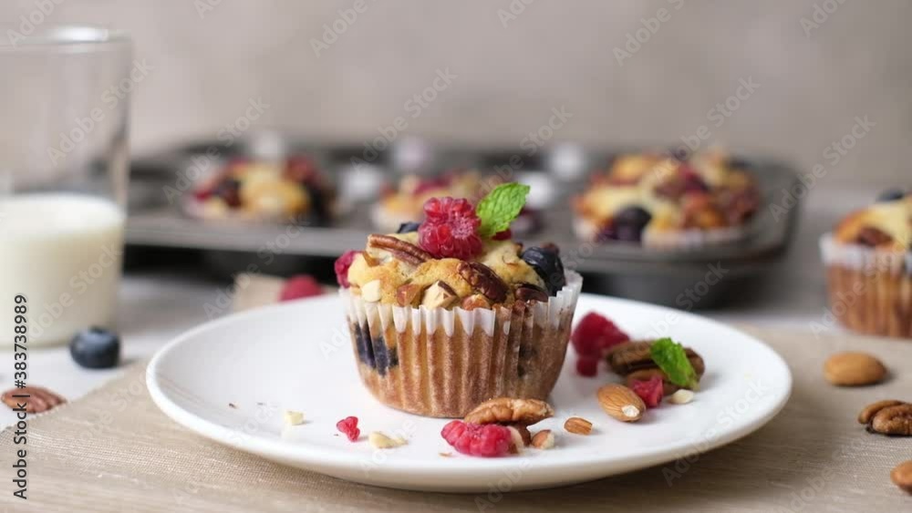 Mixed berry low carb Keto Diet muffin with almond and nut. set on cafe table. Mixed berry low carb Keto Diet muffin with almond and nut. set on cafe table.