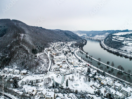 Seasons Concept winter Aerial view of the mosel village Brodenbach in Germany on a misty day photo