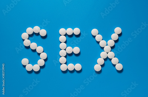 Word Sex written on blue background with pills