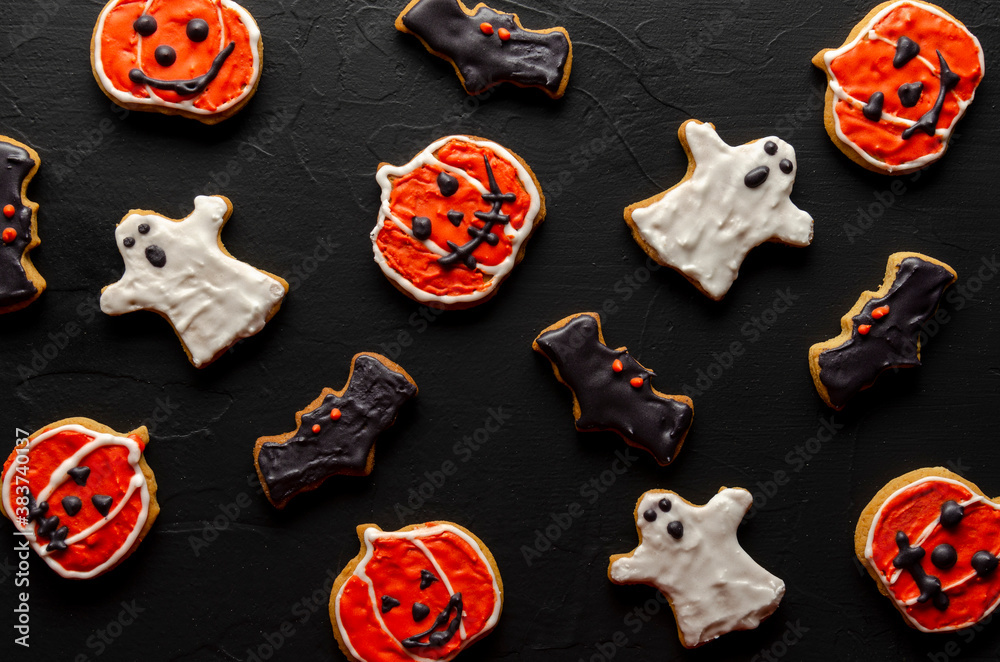 cookies for halloween on black background top view