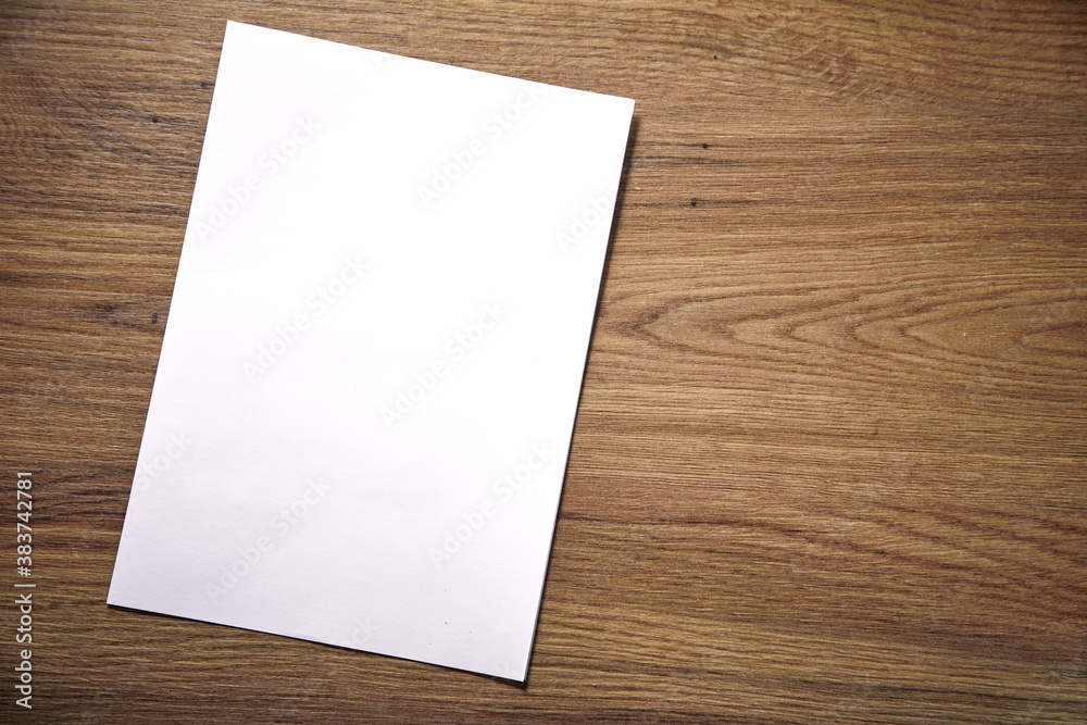 empty paper blank on wooden background empty paper blank on wooden background