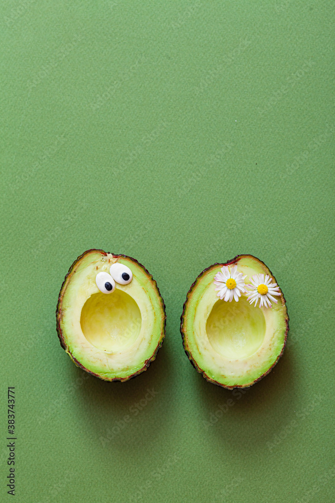 funny avocado on the green background